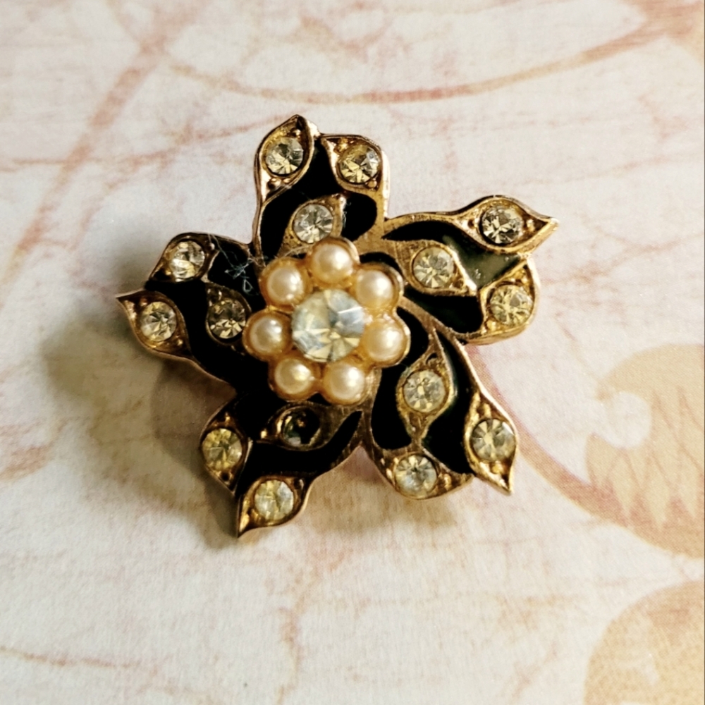 Elegant Gold and Black Floral Brooch